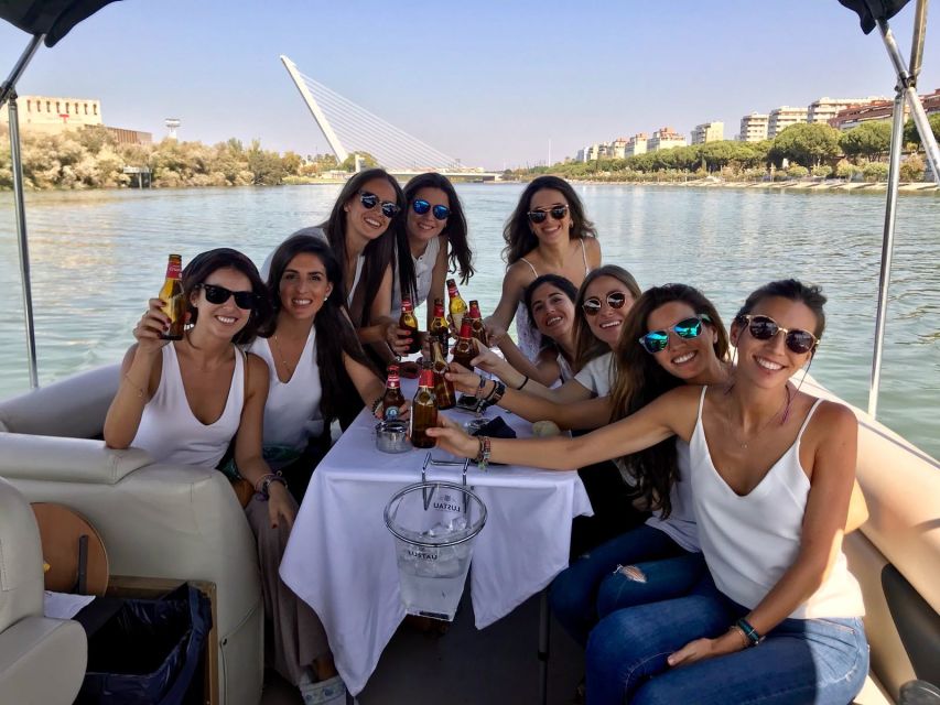 Seville: Exclusive River Boat Tour with Tapas - Triana Bridge and the historic riverfront