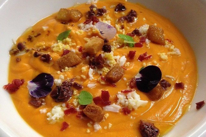 Seville Food Tour: Tapas, Drinks and Delights with a Local - Iberian ham and cheese near the Giralda