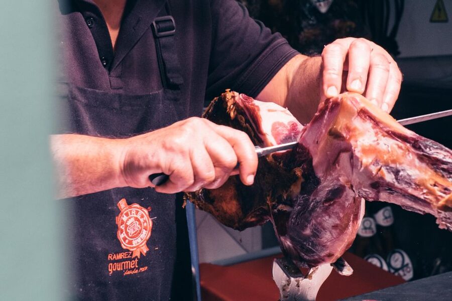 Seville: Morning Market & Tapas Tour - Cheese, cured ham, and tapas at market stalls