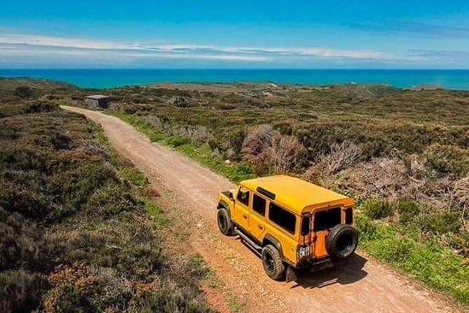 Sintra Cascais (Wine and Tapas) 4X4 Land Rover Panoramic Private Tour - Sintra village, palace towers, and a Portuguese snack stop