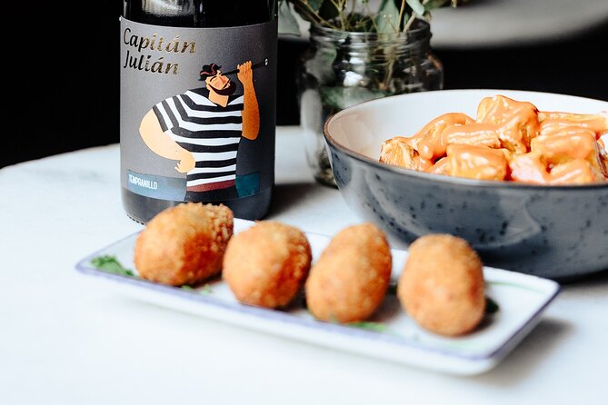 Tapas & Paella Experience | 3 Local places | Meet Travelers - Second stop: land, sea, and two more tapas