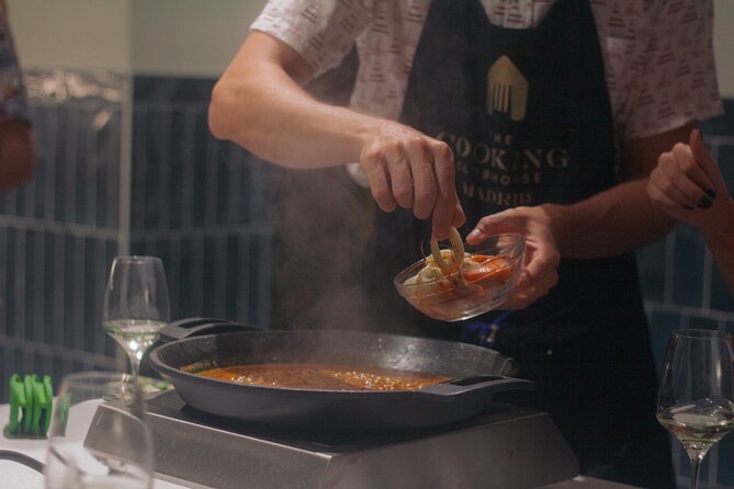 Taste of Spain: Tapas Cooking Class with Bottomless Wine Pairing - Cooking tapas at C. de Atocha