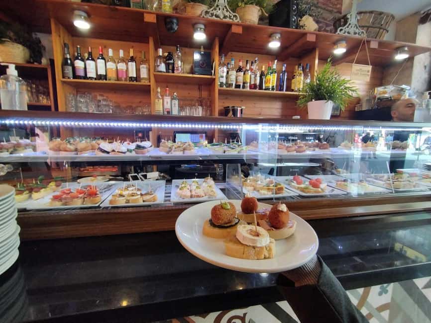 Valencia: Street Food Tour including Paella & Tapas Tasting - Valencia Cathedral, Miguelete Tower, and the old town