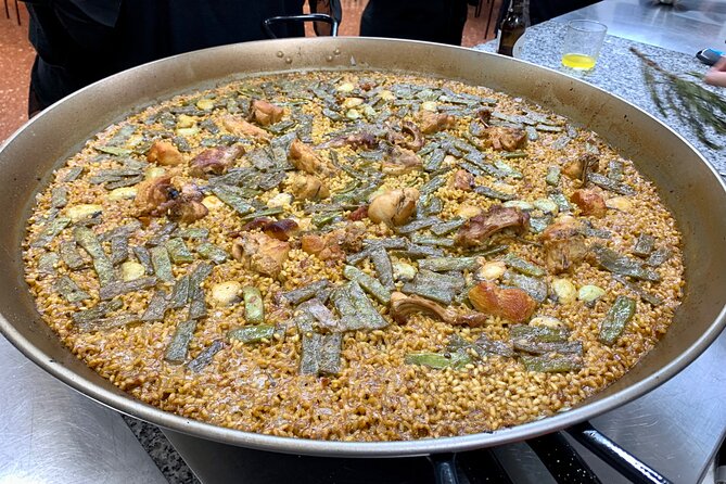 Valencian paella cooking class, tapas and visit to Ruzafa market. - Starting at San Valero Parish in Ruzafa